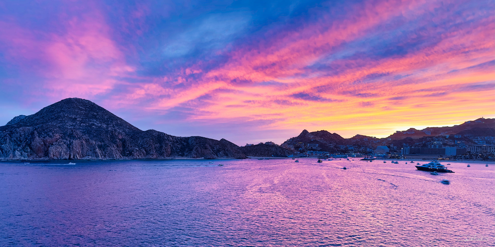Lavender pink and gold sunset over Cabo San Lucas sea — Salty Vibes